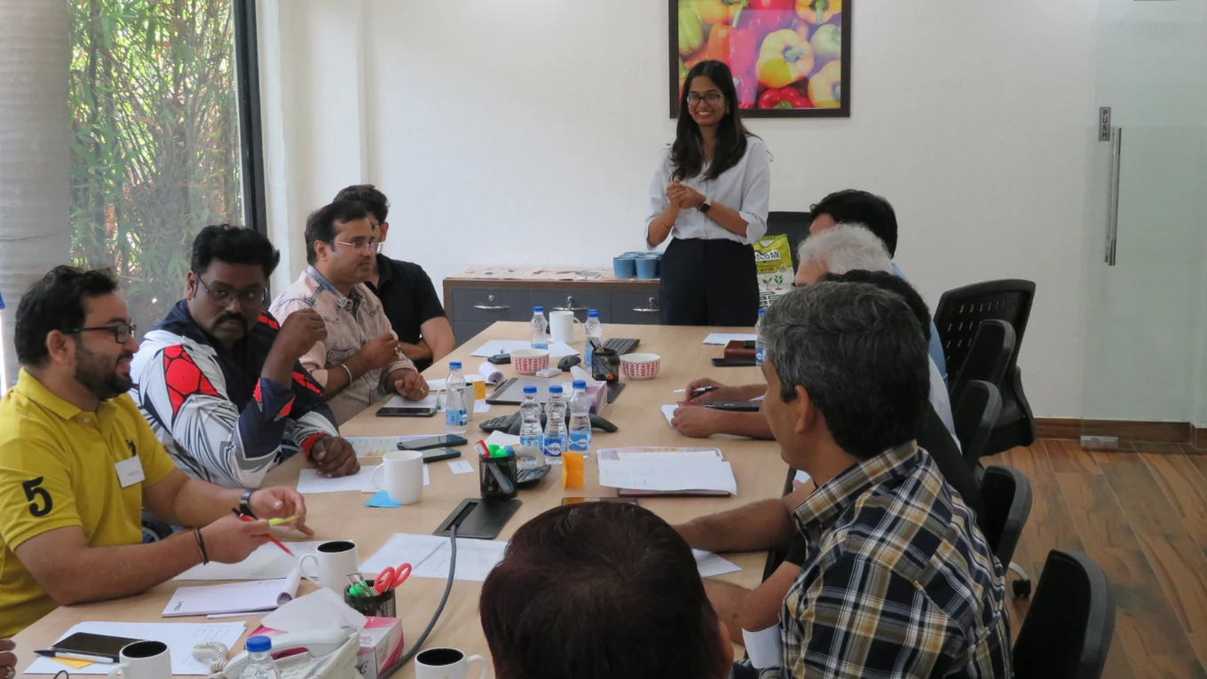 A facilitator leading a discussion with workshop participants